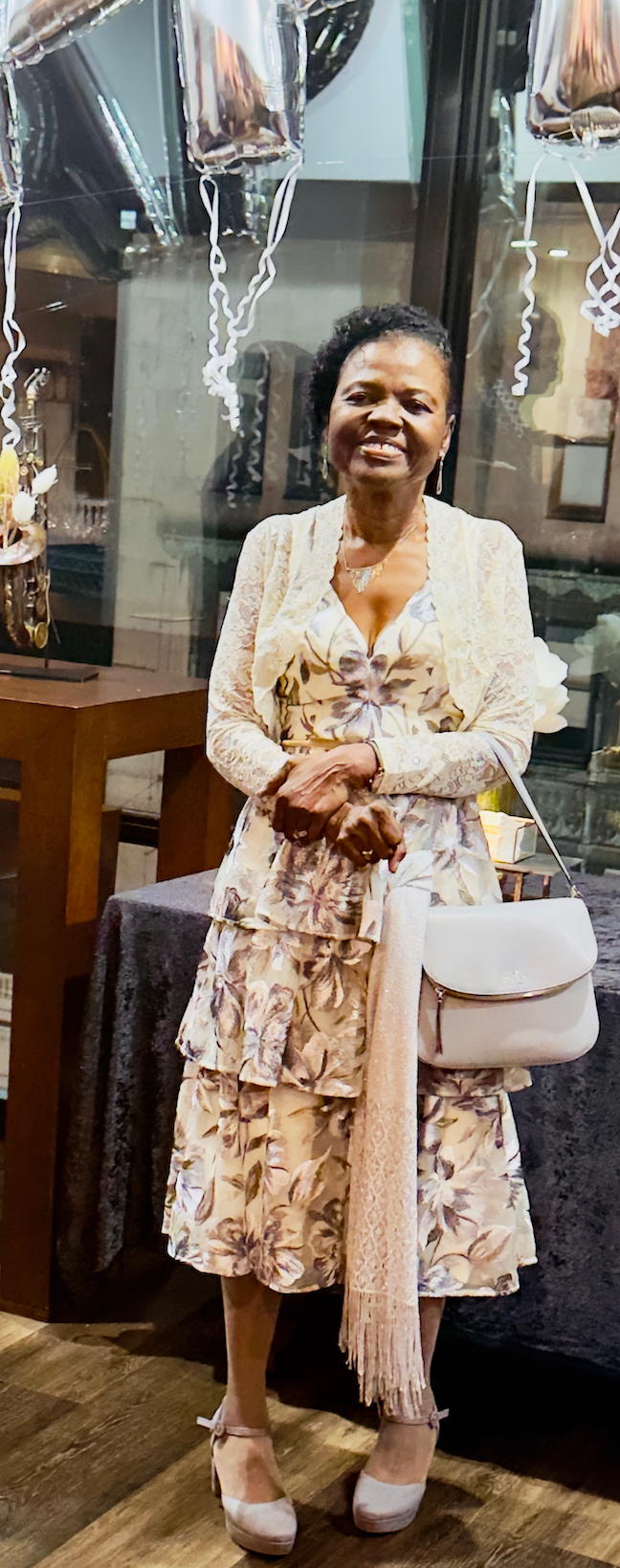 Dainty Nix, children’s book author and educator, holding a bouquet